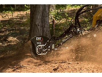 Cat SG36 stump grinder positioned at a stump